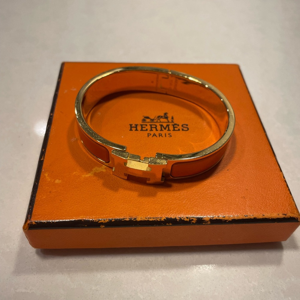 Hermès iconic orange & gold Clic H bracelet